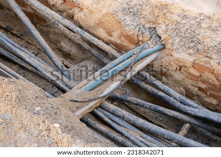 A lot of communication Cables protected in tubes. Construction site with electric cables are buried underground, infrastructure installation