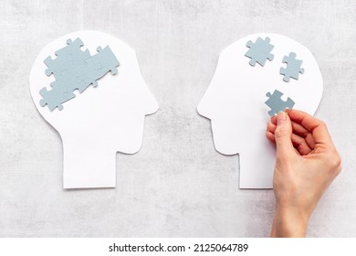 Communication. Chaos And Peace In Brain - Two Paper Human Heads With Puzzles