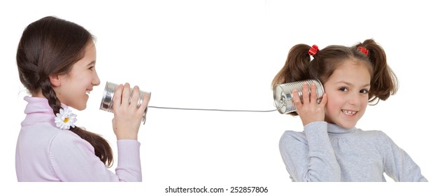 communication concepts children playing with tin can and string telephone