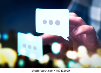 Communication, dialog, conversation on an online forum and internet chatting concept. Business man or social media consultant holding speech bubbles in futuristic modern abstract space. - Powered by Shutterstock