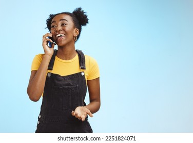 Communication, happy and talking black woman on a phone call isolated on a blue background. Contact, smile and thinking African girl in conversation on a mobile with mockup space on a studio backdrop