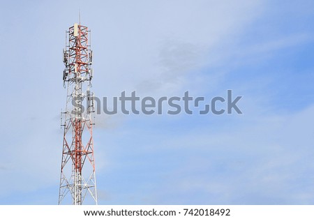 Communication Pole against blue sky background.