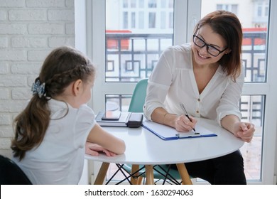 Communication Session Of School Psychologist And Girl 9, 10 Years. Child Tells Psychotherapist His Experiences, Mental Health Of Children