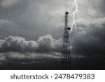 communication signal tower in heavy raining dark cloudy storm nature in rainy season