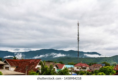 The Communication System Pole With Sky and Clouds Background, Telecommunicate in the Village and Mountain Background