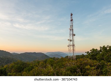 Communication tower antenna on mountain at twilight