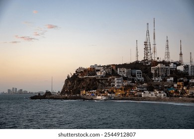 Communication towers on a hill at sunset, in Mazatlan, Mexico - Powered by Shutterstock