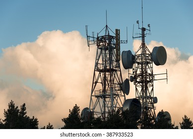 Communication And Transmission Tower For Military Use Over A Stormy Sky