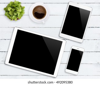 communicator device phone and tablet white color tone on wood table, mockup modern phone and digital tablet