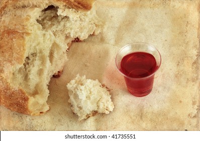 Communion Bread Loaf And Wine On A Grunge Background.