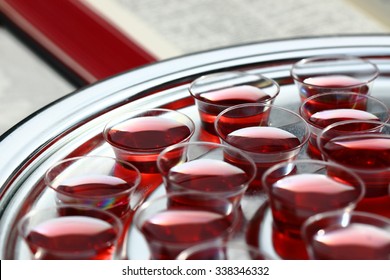 COmmunion Cups With Wine And Open Bible