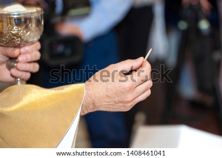 Communion and priest hand. Priest celebrate mass at the church.
