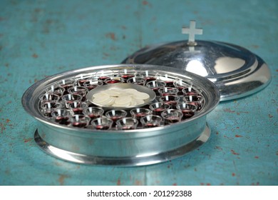 Communion tray with wafers and wine cups - Shallow depth of field on tray