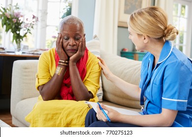 Community Nurse Visits Senior Woman Suffering With Depression