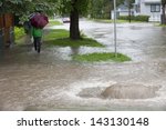 Community Residents Exploring the Flooded Streets of Their  Community