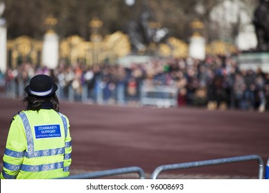 Community Support Police Officer On Duty. Daytime In Public Place Outdoor