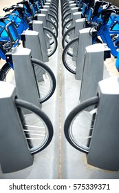 Commute blue city bikes park outside the street in New York
