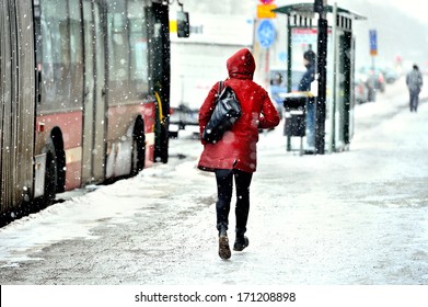 Commuter Running To Bus In Snowstorm