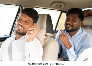 commuter talking to cab driver about location - concept of traveling on taxi, communication, journey and transportation.