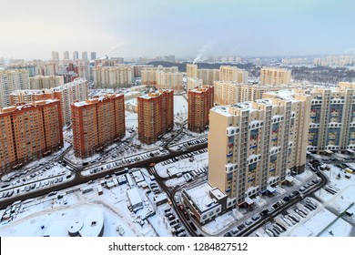 Commuter town with very dense houses. Pavshinskaya poyma district of Krasnogorsk, Moscow region, Russia. Winter snow-covered view from top of city - Shutterstock ID 1284827512