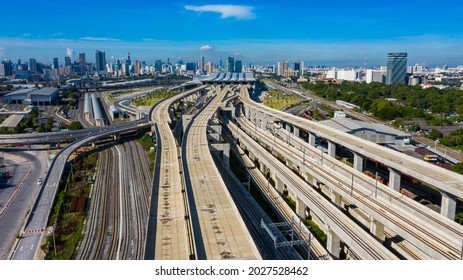 Commuter train on elevated railway. Red line electric train at Bang Sue Grand Station in Bangkok, Thailand. - Shutterstock ID 2027528462
