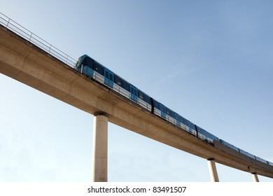 Commuter Train On Elevated Railway