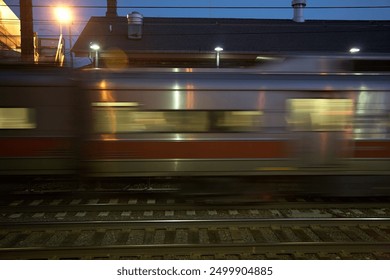 A commuter train speeding by