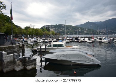 Como Lake, Lombardia Italia; April  22 2022: Cloudy Day At The Lake Boat Dock