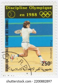 COMORO ISLANDS - 1987 January 28: An 250 Franc Multicolored Postage Stamp Showing Tennis At The 1988 Summer Olympics