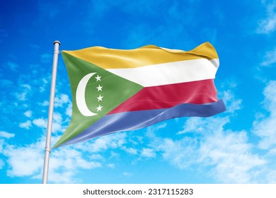 Comoros flag waving in the wind, blue sky background
