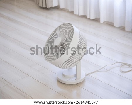 The compact air circulator placed on the floor
