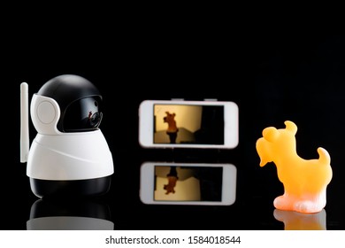 Compact Baby Monitor Security Camera Modern And Style Cordless Camera Show Video Situation In Children Room. Device For Parents Realistic