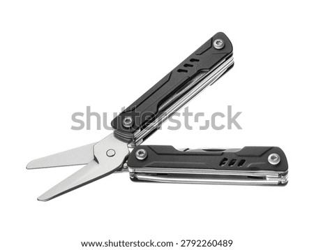Compact black multi-tool isolated on white background. Features pliers, knife, file, and screwdrivers. Versatile portable gear for repair and hiking. EDC. Everyday Carry.