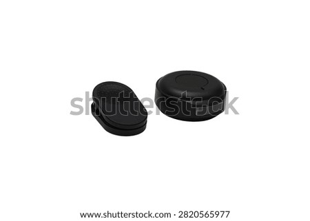 Compact black wireless microphone transmitter with a USB-C charging port and side control button, isolated on a white background.