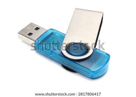 Compact blue USB flash drive featuring a metal cap for secure portable data storage.