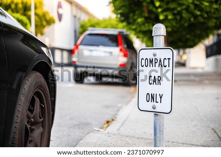 Compact Car Only sign allowing parking for small cars only in San Francisco, USA