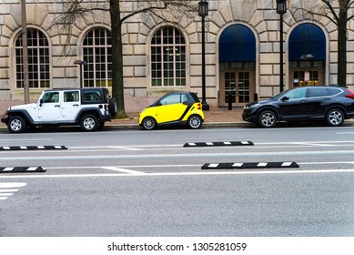 Compact Car In The Parking Lot Takes Up Little Space And Attracts Attention.