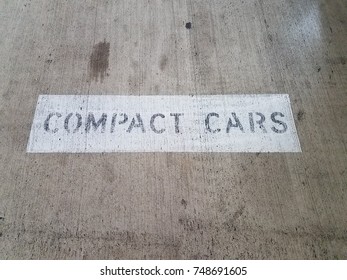 Compact Cars Sign On Cement Parking Space