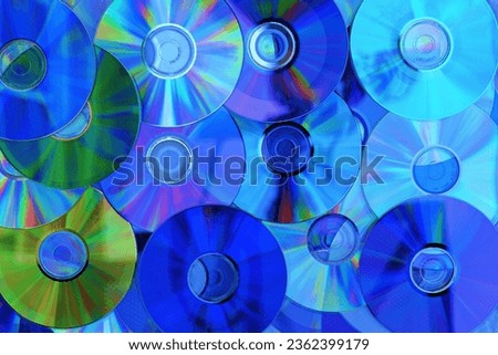 The Compact Disc (CD) is a digital storage medium for music and other digital content. The photo depicts a representation of numerous CDs and can be used as textures or backgrounds