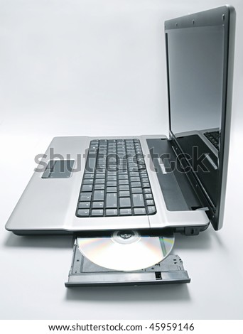 Compact disc close up on laptop computer (shallow DOF)