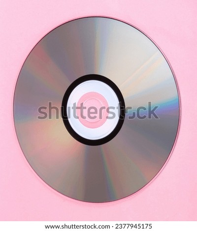 compact disc on pink background