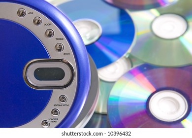 Compact discs and round  blue cd player