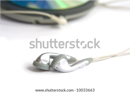 Compact discs and round  blue cd player