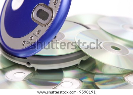 Compact discs and round  blue cd player