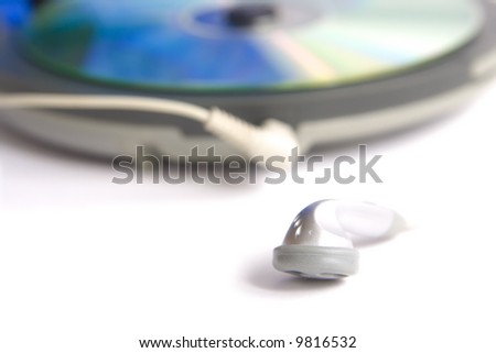 Compact discs and round  blue cd player