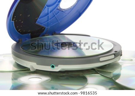 Compact discs and round  blue cd player