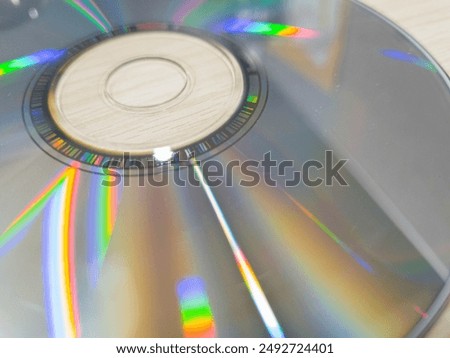 Compact disk on a wooden table. Stack of compact disc on a wooden table. Vcd, blueray