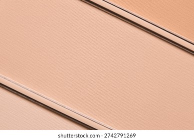 Compact face powder texture background. Eye shadow, blush, beige makeup product palette close up