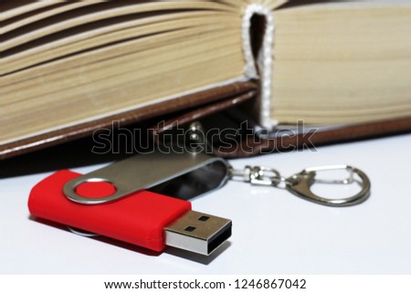 Compact Flash Memory Card and book so close, red color.