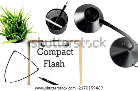 COMPACT FLASH text on clipboard on the white background